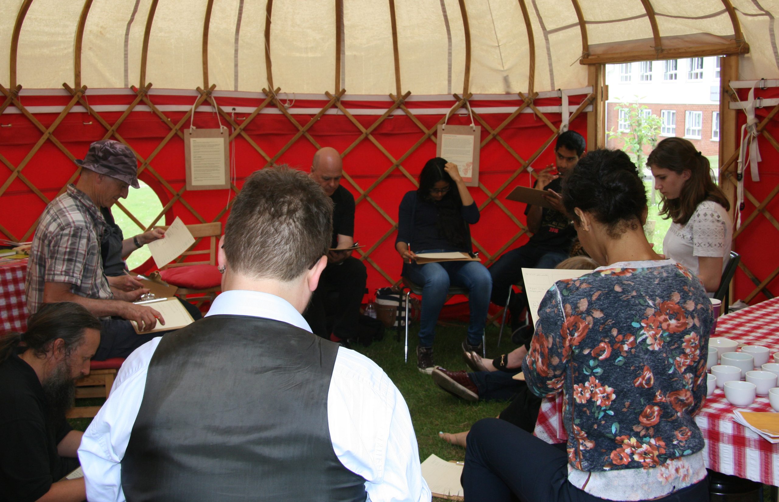 People sitting inside a yurt